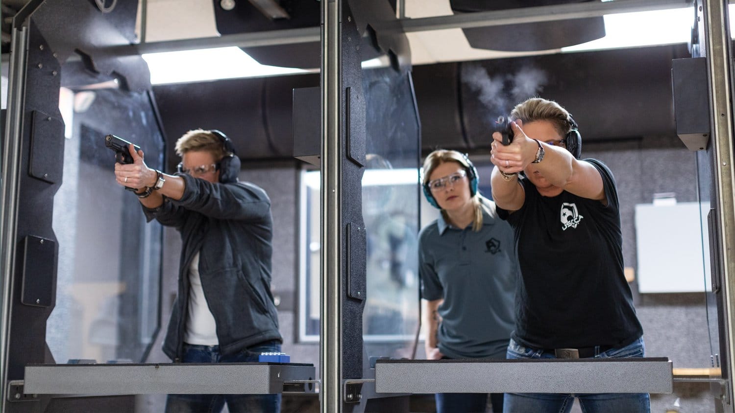 Students shooting under instructor supervision at an indoor range during a Michigan CPL class